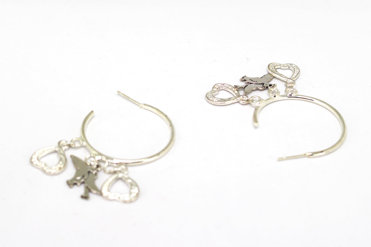 Boucles d'oreilles créoles cœurs argentés à strass et colombes